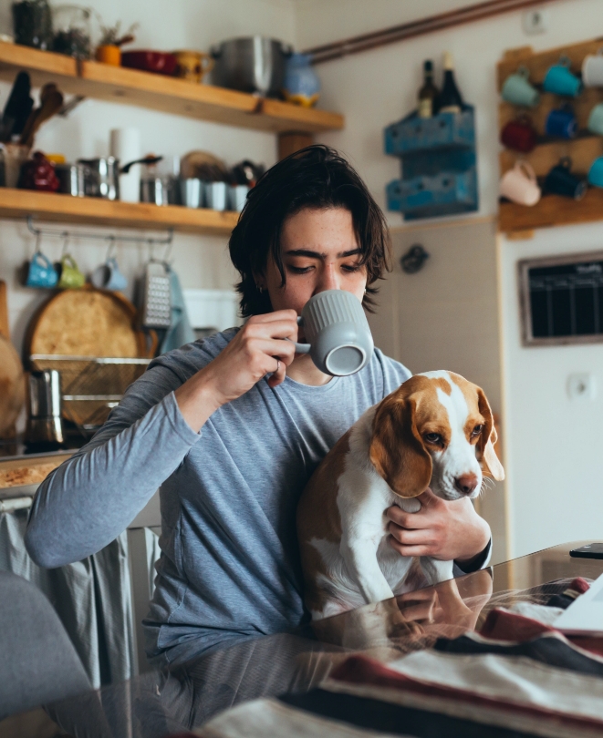 interior, kitchen, person drinking coffee with their dog